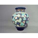 A 19 th century Burmantofts Pottery faience vase of globular form,