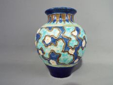 A 19 th century Burmantofts Pottery faience vase of globular form,