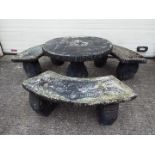 Reconstituted stone garden furniture comprising table and three benches, dismantles for transport.