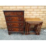 A small chest of four drawers measuring approximately 75 x 51 x 34 cm and a nest of three tables.