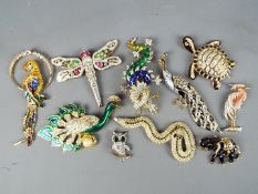 A collection of costume jewellery brooches by Swarovski and similar.