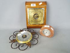 Collection of three wall mounted aneroid barometers, one in mahogany case by Walker & Hall,