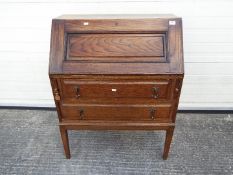 A writing bureau with fitted interior, measuring approximately 99 cm x 76 cm x 43 cm.