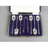A George V cased set of six silver coffee spoons and tongs, Sheffield assay 1920,