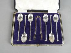 A George V cased set of six silver coffee spoons and tongs, Sheffield assay 1920,