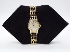 A lady's 9ct gold Omega wristwatch, yellow gold case and bracelet, approximately 18 grams all in.