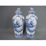 A pair of 20 th century Delft ginger jars and covers, approximately 31 cm (h) including cover.