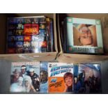 Two boxes of 12" vinyl records, various genres, to include Herman's Hermits, 10cc, Village People,