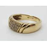 A hallmarked 9ct gold ring set with diamond chips, size N ½, approximately 4.62 grams all in.