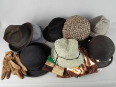 A mixed lot of vintage hats and gloves.