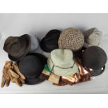 A mixed lot of vintage hats and gloves.