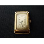A 9ct gold cased wristwatch, lacking strap, approximately 15.1 grams all in.