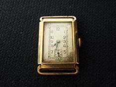 A 9ct gold cased wristwatch, lacking strap, approximately 15.1 grams all in.