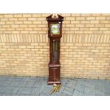 A modern longcase clock with three weights and pendulum,