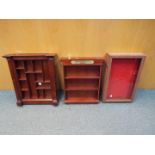 A mixed lot of three wall or table mounted display cases for collectables.