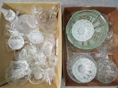 Two boxes of mixed glassware to include decanters, drinking glasses, bowls and similar.