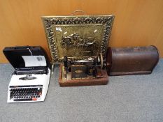 A vintage Singer sewing machine in case, cased Brother typewriter and brass bound fire screen.