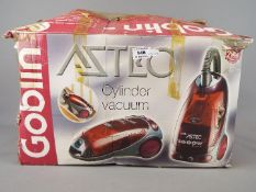 A boxed Goblin Aztec cylinder vacuum cleaner.