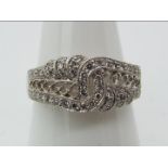 An 18ct white gold, diamond chip encrusted ring, size P+½, approximately 5.3 grams all in.