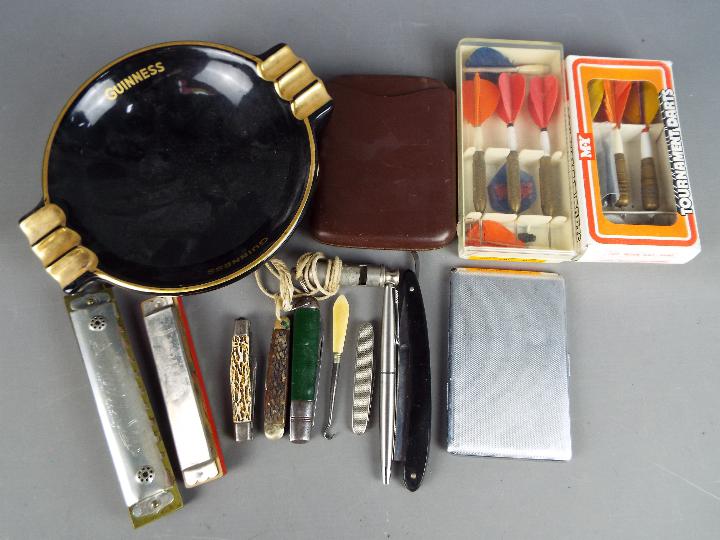 A mixed lot of collectables comprising two harmonicas, Jupiter and World Star, vintage darts,