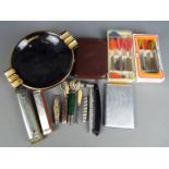 A mixed lot of collectables comprising two harmonicas, Jupiter and World Star, vintage darts,