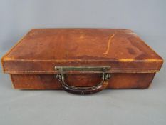 An interesting vintage case with combined handle / lock mechanism.
