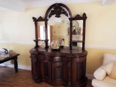 A mahogany Credenza, serpentine fronted with mirrors above, as illustrated,