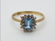 A hallmarked 9ct gold cluster ring, size O+½, approximately 2.1 grams all in.