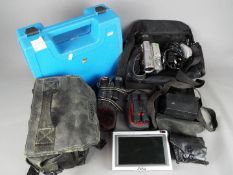 A collection of camera equipment and similar to include a cased Philips camera,