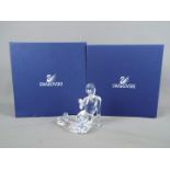 Swarovski - A Swarovski Crystal figurine depicting a mermaid holding a pearl,