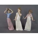 Nao - Three large Nao figurines depicting young girls, largest approximately 29 cm (h).
