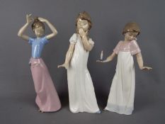 Nao - Three large Nao figurines depicting young girls, largest approximately 29 cm (h).