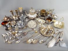 A collection of plated ware to include vases, flatware, goblets and similar.