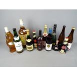 A collection of alcoholic drinks to include wine, Benedictine and similar, also includes a large,