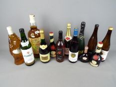 A collection of alcoholic drinks to include wine, Benedictine and similar, also includes a large,