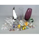 A collection of glassware to include paperweights, animal figurines, vases,