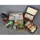 A mixed lot of collectables to include vintage money bank, various vintage playing cards,