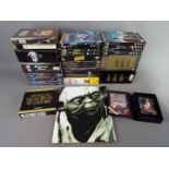 A quantity of DVD's and videos to include, Star Wars, Lord of the Rings, Harry Potter and others,