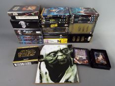 A quantity of DVD's and videos to include, Star Wars, Lord of the Rings, Harry Potter and others,