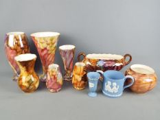 A collection of Oldcourt Ware lustre ceramics and two pieces of Wedgwood Jasperware.