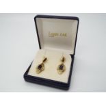A pair of 9ct gold, stone set, drop earrings.