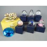Six boxed paperweights, a limited edition capodimonte model depicting birds and flowers,