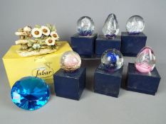 Six boxed paperweights, a limited edition capodimonte model depicting birds and flowers,