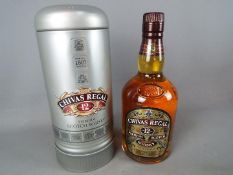 A bottle of Chivas Regal 12 year old 70 cl 40% ABV in presentation tin