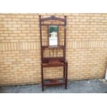 A good quality mahogany hall stand measuring approximately 193 cm x 67 cm x 28 cm.
