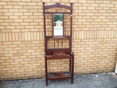 A good quality mahogany hall stand measuring approximately 193 cm x 67 cm x 28 cm.