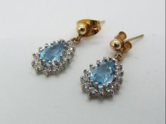 A pair of stone set drop earrings, stamped 9K.