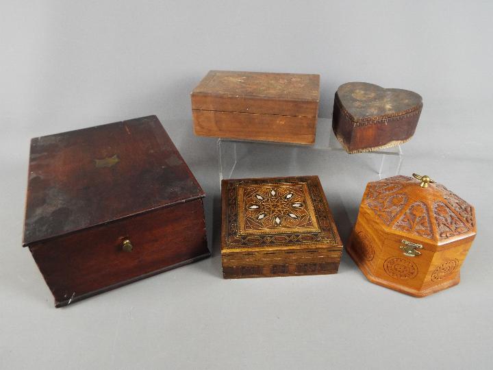 A small collection of wooden trinket boxes and similar,