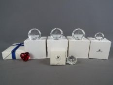 Swarovski - A collection of Swarovski Crystal paperweights, all boxed.