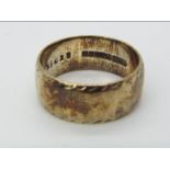 A hallmarked 9ct gold wedding band, size M+½, approximately 5.9 grams all in.